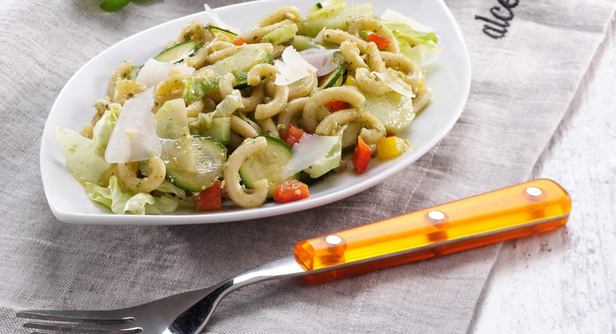 Semolina gramigna pasta with raw summer vegetables and pesto alla genovese