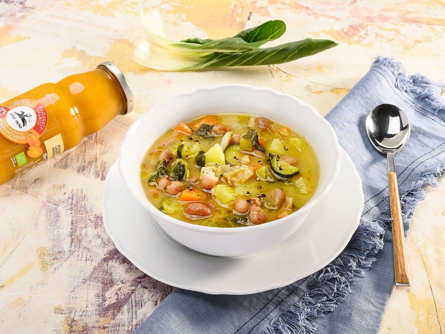 Borlotti bean soup with vegetables and smooth yellow tomato purée