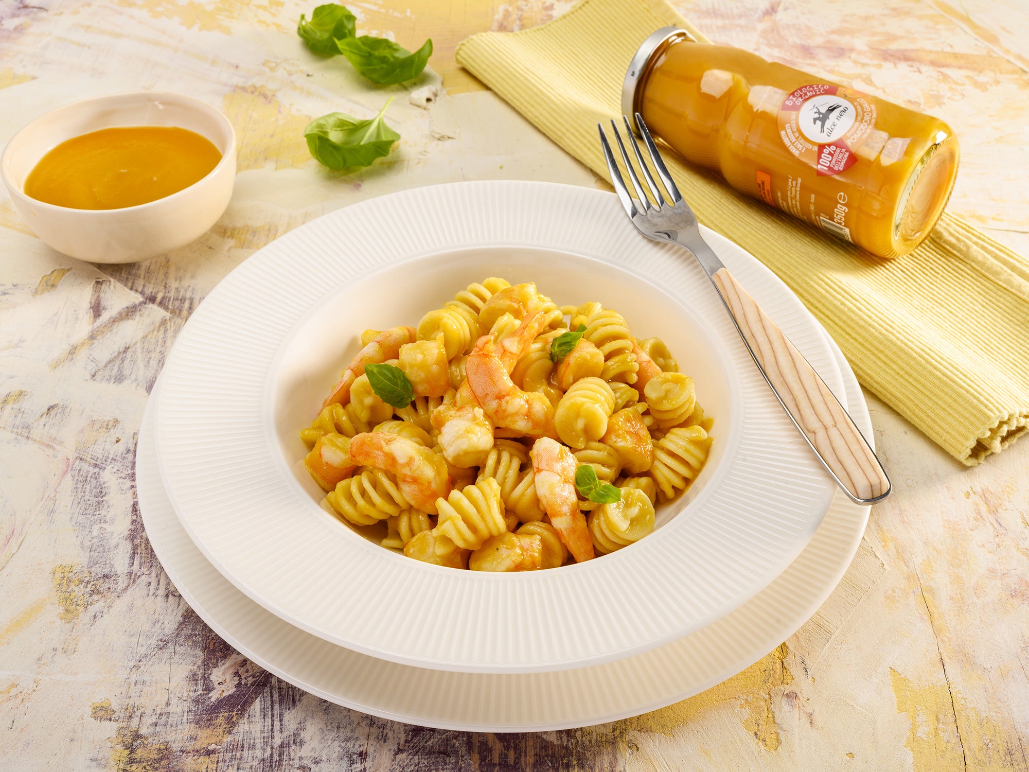 Cappelli durum wheat fusilloni with yellow tomato purée, prawns and basil